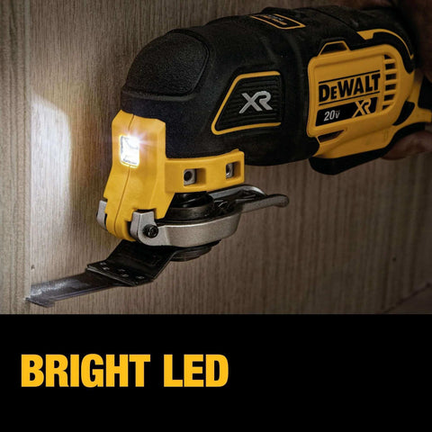 Close-up of 20V Max XR Oscillating Tool Kit with bright LED light, showing brushless cordless multitool cutting into wood panel.