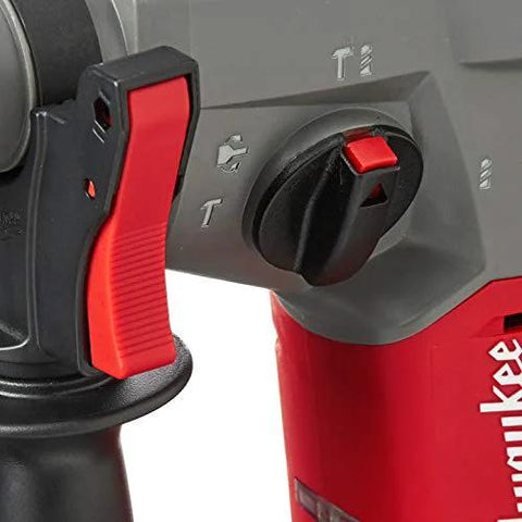Close-up of 18V cordless brushless SDS Plus rotary hammer controls, showing mode switch and grip handle for drilling and chiseling.