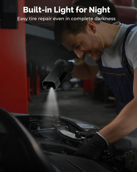 Person using Cordless Tire Inflator Portable Air Compressor with Digital Pressure Gauge and LED Light on car tire at night