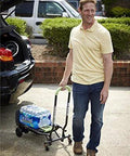 Man using COSCO Shifter Multi-Position Folding Hand Truck and Cart, 300 lb. Weight Capacity, Green, 12222PBG1E