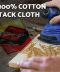 Close-up of a Ryobi sander on wood with Mouse Sanding Pads Assortment for Ryobi Sander 70 Pc 6 Hole with 40 to 320 Grit, cotton tack cloth visible