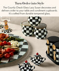 Mackenzie-Childs Glass Lazy Susan 360 Degree Rotating Serving Board In Black And White Courtly Check with condiments and dishes