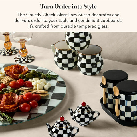 Mackenzie-Childs Glass Lazy Susan 360 Degree Rotating Serving Board In Black And White Courtly Check with condiments and dishes