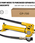 CP-700 Manual Hydraulic Hand Pump with hose and fittings, packaging in background. For 30 ton Low Profile Hydraulic Jack Porta Power Kit.