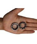 Hand holding Bike Ball Crank Bearing Retainer One Quarter Inch With Nine Balls Four Pieces Bottom Bracket Bearings for kids' bikes.