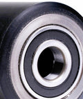 Close-up of Crown PTH50 pallet jack front load wheels replacement kit showing polyurethane wheel with pre-greased bearing.
