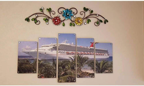 Decorative metal wall art above a segmented cruise ship photo mounted with stainless steel standoffs screws.