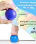 Hand holding a colorful ball pit ball highlighting non-toxic, crush-proof design with pressure demonstration text, Colorful Ball Pit Balls 100pcs for Kids, BPA & Phthalate Free, Crush Proof and Non-Toxic, Plastic Balls for Ball Pit with Reusable Net Bag - Perfect for Play Tents & Parties.