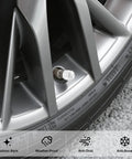 Silver wheel with 4 Pack Handmade Crystal Rhinestone Tire Valve Stem Caps for cars, trucks and motorcycles, close-up view.