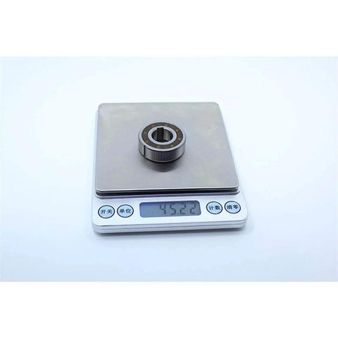 CSK15PP One Way Bearing Clutches 15 * 35 * 11mm with Keyway CSK6202PP on scale showing weight in grams