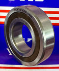 Close-up of CSK30 One-Way Clutch Bearing - Sprag Freewheel Backstop; 30mm x 62mm x 16mm metal bearing on blue and red background.