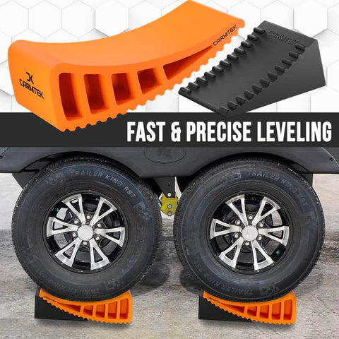 Pro Grade Camper Leveler Kit With Curved RV Levelers Wheel Chocks Rubber Mats And Carry Bag For Tight Dual Axle Trailers Faster RV Leveling System Than Blocks Includes Patented Anti Slip Jointing For Secure Leveling shown in use under dual-axle wheels.