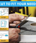 Person cutting Clear 10Ft Indoor Outdoor Adhesive Mounting Tape With Self Mating Reclosable Fasteners No Drilling Required Cut To Size