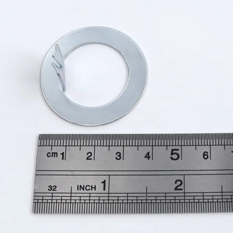 Spindle Washer D Shape Set Of 10 For Ez Lube Axles 2K To 7K 1 Inch ID next to a ruler showing size details