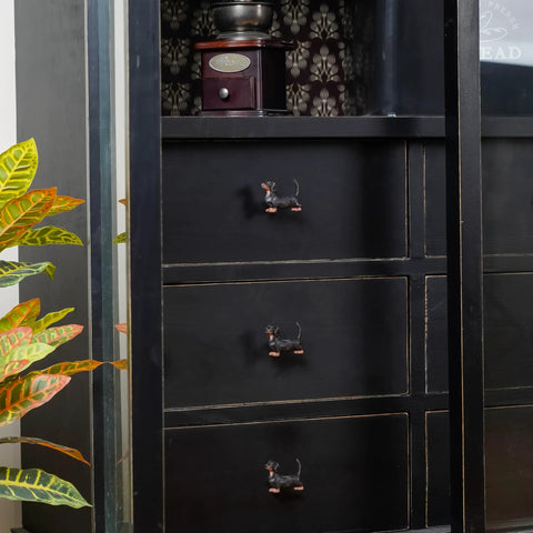 Black cabinet with Two Piece Vintage Dachshund Cabinet Pulls Set Decorative Metal Knob Handles for Doors Cabinets and Drawers installed