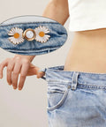 Person showing loose jeans with Daisy Flower Jeans Button Tightener For Loose Jeans Adjustable No Sew No Tools Pins attached.