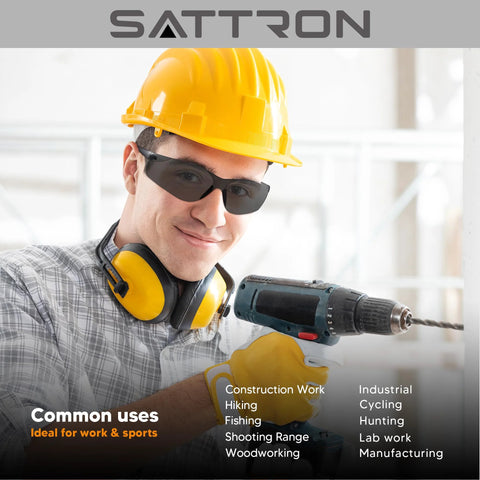 Person wearing Dark Tinted Safety Glasses 24 Pack ANSI Z87 UV Eye Protection For Construction, using a power drill.