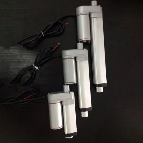 Three 24V DC Linear Actuators With 50mm Stroke 750N Lift IP65 Aluminum Housing showing different sizes, on black background.