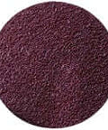 Close-up of a round, textured, maroon abrasive disc for sanding and surface preparation.