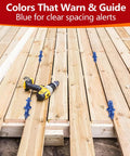 Six Pack 4 In 1 Deck Spacers Tool With Four Size Options For Five Thirty Second Inch Three Sixteenth Inch One Quarter Inch And Five Sixteenth Inch Easy To Use Gap Tool For Composite PVC Hardwood And Pressure Treated Decking Boards Red And Blue visible on wooden deck with drill.