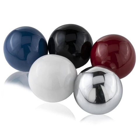 Assorted decorative balls including Bola Polished Sphere, Silver Aluminum, 5-inch, for home decor and centerpiece bowls.