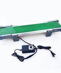 Desktop Belt Conveyor With Stepless Speed Control For Packaging Factories And Assembly Lines Small Laboratory Conveyor For Friction Experiments And Science And Technology Learning 10 By 100 Cm shown with green belt and control unit.