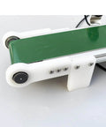 Close-up of green PVC desktop conveyor belt, 1000mm x 10cm, for smooth transport and physics friction experiments, with automatic counter.