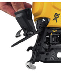 Close-up of DEWALT 20V MAX XR Cordless Angled 16GA Finish Nailer adjustment mechanism with yellow and black design in use.