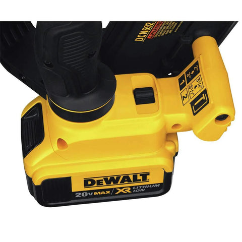 Close-up of DeWalt 20V Max XR cordless framing nailer kit with labeled controls, 30 degree paper collated nails, and 4Ah battery.