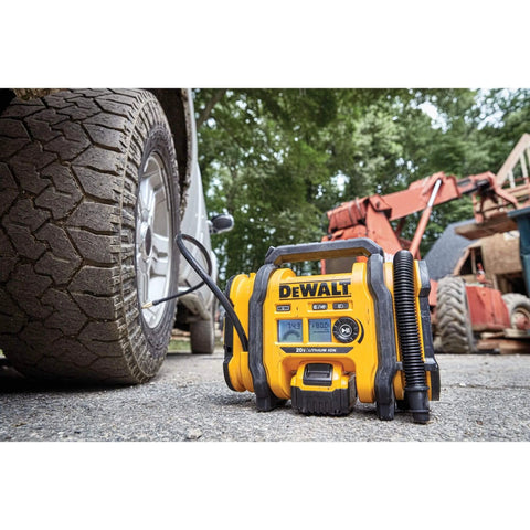 DEWALT Tire Inflator Portable Air Compressor 20V MAX, Car Air Pump with Automatic Shut Off next to car tire