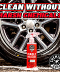 Diablo Wheel Cleaner Spray Two Pack 16 Oz Bottles in front of a car wheel, highlighting safe cleaning on chrome and aluminum surfaces.