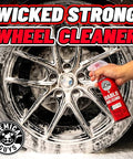 Hand spraying Diablo Wheel Cleaner on chrome wheel to remove brake dust and grime, showcasing safe use on custom wheels.
