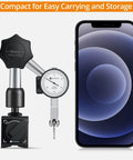 Dial Test Indicator with Magnetic Base Stand and Storage Case next to smartphone for size comparison