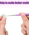 Close-up of a 2 Piece Bead Reamer Tool Set With Diamond Tipped Reamers For Jewelry Making in use on a bead, showing non-slip handle.