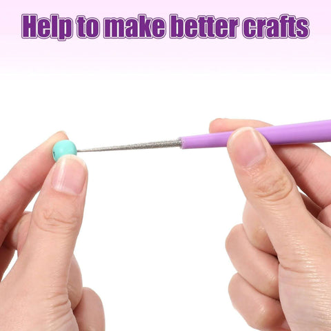 Close-up of a 2 Piece Bead Reamer Tool Set With Diamond Tipped Reamers For Jewelry Making in use on a bead, showing non-slip handle.