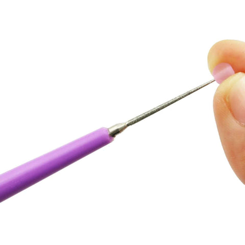 Diamond Tipped Bead Reamer Set 5 Piece For DIY Beaders And Jewelry Makers Quickly Enlarges Bead Holes In Glass Plastic Metal Wood With Easy Grip ABS Handle And Stainless Steel Reamers By Tegg in use with a bead.