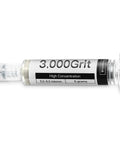 Diamond polishing compound with 30% diamond powder, 5-6 micron grit, oil-based paste in syringe labeled 3000 grit.