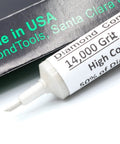 Close-up of USA Made Oil Based Diamond Polishing Compound Paste 14000 Grit 0-1 Microns, syringe tip visible, for precision finishing.