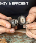 Hands using a rotary tool with high density diamond polishing paste, 3,000 grit for mirror finishes on metal jewelry, shown up close