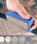Hand using Six Piece Diamond Hand Polishing Pads Set 60 To 1000 Grit for tile, demonstrating polishing capability on various surfaces.