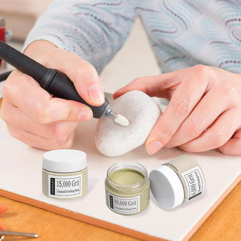 Person using 80000 Grit Diamond Polishing Paste With Twenty Five Percent Diamond Powder Point One Micron on stone with tool