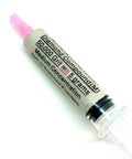 Close-up of a syringe labeled diamond compound, 50,000 grit, with 25 percent diamond powder for metal, glass, and ceramics polishing.