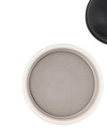 Top view of Absorbent Dry Earth Disk Refill for Toilet Brush Holder With Diatomaceous Earth in ceramic base, showing fit and design.