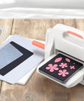 Die Cutting And Embossing Machine With Adjustable Height Gear System For Effortless Crafting, 9 inch opening on wooden table
