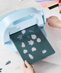 No Fuss Die Cutting And Embossing Machine With An 8.5 Inch Opening for card making and scrapbooking, showing die cuts in action, OFFNOVA.