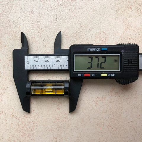 Digital caliper measuring acrylic bubble tool from Four Pack Gunsmith Scope Leveling Bubble Tools With Magnetic Base.