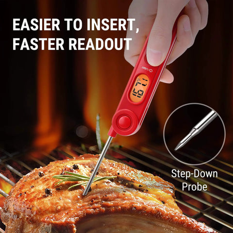 Red digital meat thermometer inserted in grilled meat, showing temperature on backlit display. Digital Meat Thermometer for Cooking.