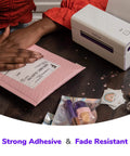 Direct Thermal 4x6 Shipping Labels Pack of 500 Fanfold Perforated With Strong Adhesive being applied to a pink mailer.
