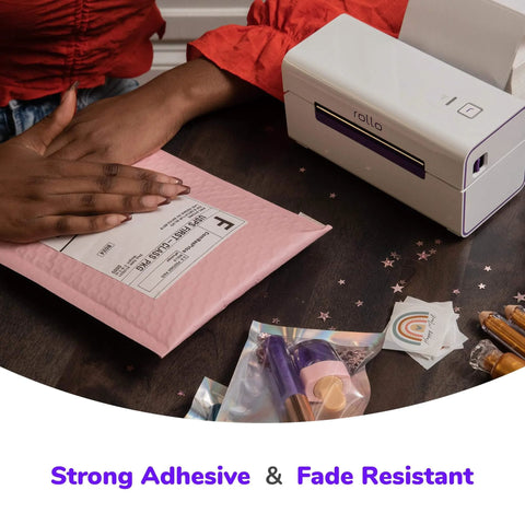 Direct Thermal 4x6 Shipping Labels Pack of 500 Fanfold Perforated With Strong Adhesive being applied to a pink mailer.