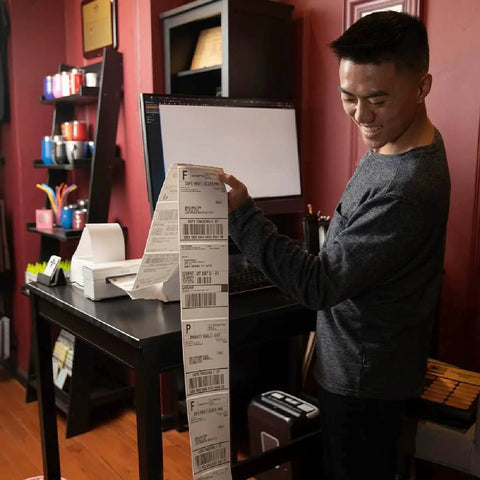 Person using printer with Direct Thermal 4x6 Shipping Labels Pack of 500 Fanfold Perforated With Strong Adhesive